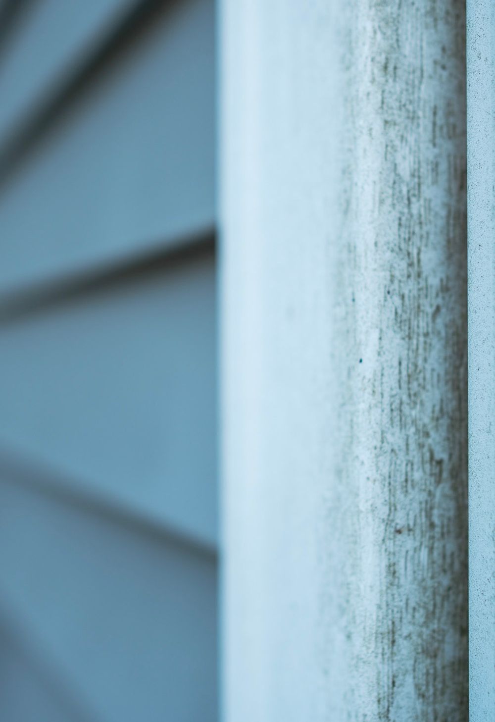 downspout clogged with debris before cleaning