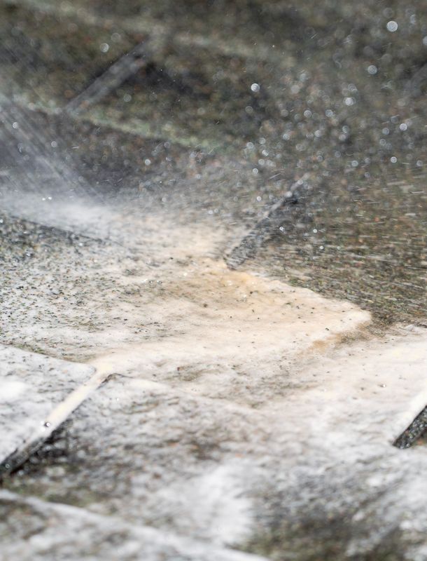 dirty water being washed off the roof