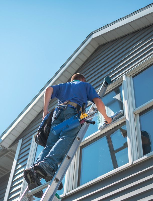 window cleaner on a ladder